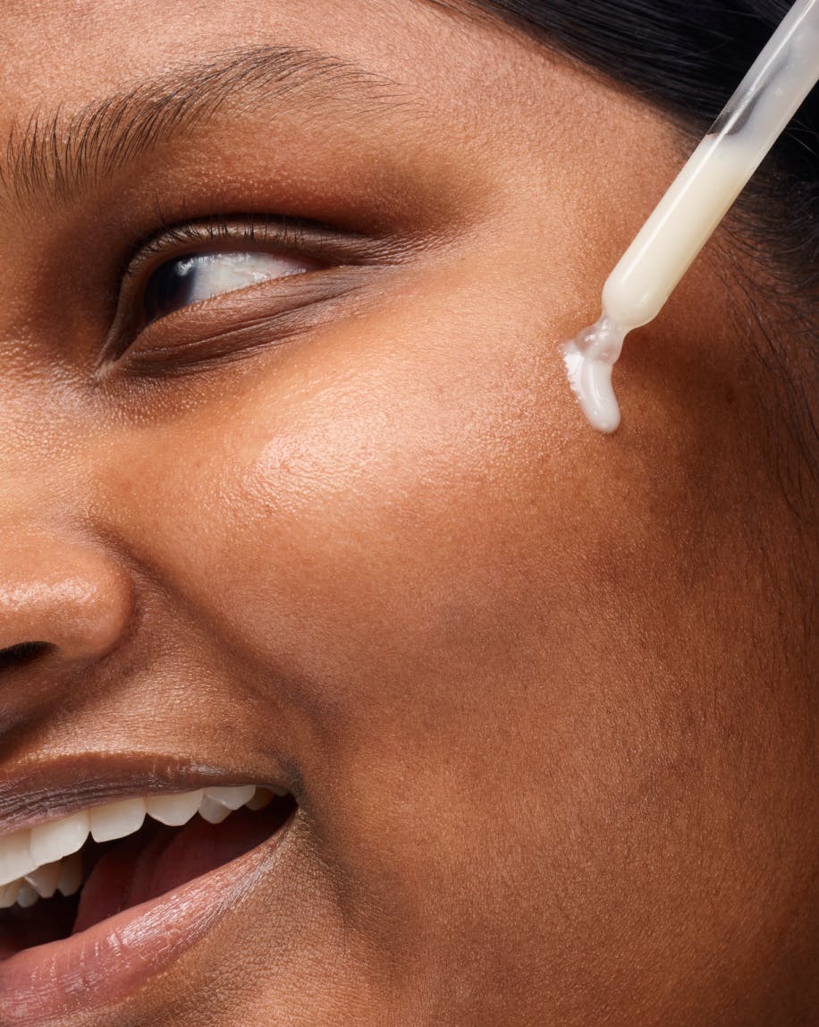 close up of model applying Super Glow